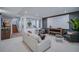 Inviting living room featuring a large movie screen, comfortable seating, and natural light at 2599 S Cherokee St, Denver, CO 80223
