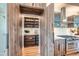 Butler's pantry featuring beautiful wood cabinetry and shelving, perfect for storage and organization at 2599 S Cherokee St, Denver, CO 80223