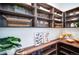 Walk-in pantry featuring custom shelving and storage solutions, perfect for organized kitchen essentials at 2599 S Cherokee St, Denver, CO 80223