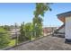 Wide angle view of the rooftop deck and black railings with views of the city skyline at 2599 S Cherokee St, Denver, CO 80223