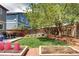 The backyard features a lush lawn and garden with space for relaxing and entertaining at 4907 Fenwood Dr, Highlands Ranch, CO 80130