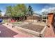 Beautiful backyard features garden beds, a brick patio and lovely landscaping, perfect for outdoor living at 4907 Fenwood Dr, Highlands Ranch, CO 80130