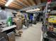 Unfinished basement with exposed beams and shelving ready for your imagination to make it your own at 4907 Fenwood Dr, Highlands Ranch, CO 80130