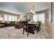 Open-concept dining area boasts comfortable seating and ample natural light for relaxed meals at 4907 Fenwood Dr, Highlands Ranch, CO 80130