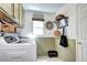 Functional laundry room with modern washer and dryer, ample storage, and neutral tones at 4907 Fenwood Dr, Highlands Ranch, CO 80130