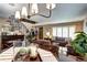 Open-concept living room with neutral walls, plush furniture, and large windows providing natural light at 4907 Fenwood Dr, Highlands Ranch, CO 80130