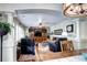 Inviting living room with a cozy fireplace and comfortable seating area at 4907 Fenwood Dr, Highlands Ranch, CO 80130