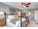 Spacious main bedroom with a comfortable bed, side tables, and a ceiling fan at 4907 Fenwood Dr, Highlands Ranch, CO 80130