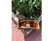 A basket full of freshly harvested tomatoes, zucchini, and cucumbers from the garden at 4907 Fenwood Dr, Highlands Ranch, CO 80130