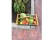 Wooden basket full of harvested cabbage, broccoli, tomatoes, cucumbers and squash at 4907 Fenwood Dr, Highlands Ranch, CO 80130