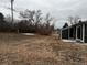 Backyard of property with grass and trees with a view of a building at 6392 S Hill St, Littleton, CO 80120