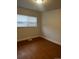 Bedroom featuring laminate flooring, closet, and natural light at 6392 S Hill St, Littleton, CO 80120