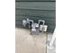 Home utilities on exterior with siding next to a concrete slab at 6392 S Hill St, Littleton, CO 80120