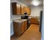 Well-lit kitchen featuring wood cabinets and modern appliances at 6392 S Hill St, Littleton, CO 80120