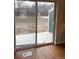 View of the backyard through sliding glass door off the living room at 6392 S Hill St, Littleton, CO 80120