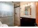 Modern bathroom featuring a glass shower door, tiled walls, and a sleek vanity with granite countertops at 32 Magnum Bonum Dr, Breckenridge, CO 80424