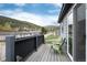Relaxing deck with seating, views of the mountains and surrounding neighborhood at 32 Magnum Bonum Dr, Breckenridge, CO 80424