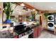 Spacious kitchen with red cabinets, stainless appliances, open design, and granite counters at 32 Magnum Bonum Dr, Breckenridge, CO 80424
