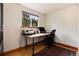 Bright office space with hardwood floors, a view of trees, a wooden desk and a comfortable rolling chair at 32 Magnum Bonum Dr, Breckenridge, CO 80424