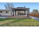 Backyard features a gazebo with outdoor seating and a dining area, and fenced-in yard at 10661 W 104Th Ave, Broomfield, CO 80021