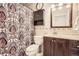Bathroom featuring a shower with a patterned curtain, tile walls, and vanity with a dark wood cabinet at 10661 W 104Th Ave, Broomfield, CO 80021