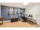 Bedroom features six guitars hanging on the wall above a blanket-covered trunk, and a small desk at 10661 W 104Th Ave, Broomfield, CO 80021