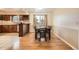 Bright dining area with hardwood floors next to the kitchen with natural light at 10661 W 104Th Ave, Broomfield, CO 80021