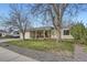 Street view of a charming ranch style home with mature trees and manicured lawn at 10661 W 104Th Ave, Broomfield, CO 80021