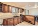 This kitchen features beautiful wood cabinets, granite countertops, and stainless steel appliances at 10661 W 104Th Ave, Broomfield, CO 80021