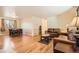 Open concept living room and dining area with hardwood floors and neutral paint at 10661 W 104Th Ave, Broomfield, CO 80021