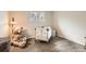Bedroom with teddy bear, crib, and natural light from the window at 6238 S Cherry Cir, Centennial, CO 80121