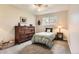A bright, cozy bedroom with dresser, natural light, and comfortable furnishings at 6238 S Cherry Cir, Centennial, CO 80121