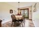 Inviting dining room with wood floors, classic chandelier, and sliding glass doors opening to outdoor space at 6238 S Cherry Cir, Centennial, CO 80121