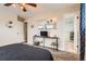 A primary bedroom features a ceiling fan, tv, mirror, and en suite bathroom at 6238 S Cherry Cir, Centennial, CO 80121