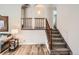 Elegant staircase with wood railing and carpeted steps leads to the upper level of the home at 6238 S Cherry Cir, Centennial, CO 80121