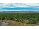 Expansive aerial view showcasing the neighborhood, lush greenery, and breathtaking mountain backdrop at 4559 Ashfield Dr, Boulder, CO 80301