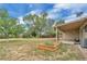 Well-maintained backyard with a patio, raised garden bed, and lush greenery at 4559 Ashfield Dr, Boulder, CO 80301