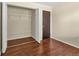 Bedroom featuring wood-look flooring, a closet with shelving and ample space for comfort and convenience at 4559 Ashfield Dr, Boulder, CO 80301
