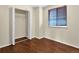 Bedroom showcasing a window and a closet with shelving for storage solutions at 4559 Ashfield Dr, Boulder, CO 80301