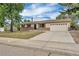 Single-story home featuring a neutral paint scheme, brick accents, and an attached two-car garage at 4559 Ashfield Dr, Boulder, CO 80301
