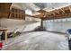 Spacious two-car garage with high ceilings and ample storage space, including 3 mowers at 4559 Ashfield Dr, Boulder, CO 80301
