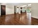 Spacious living area with hardwood flooring seamlessly connecting to the kitchen at 4559 Ashfield Dr, Boulder, CO 80301