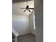 View of carpeted bedroom with ceiling fan and arched window, showing bright natural light at 16366 E Fremont Ave # 11, Aurora, CO 80016