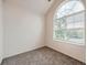 Bright bedroom with a large arch window, offering natural light at 16366 E Fremont Ave # 11, Aurora, CO 80016