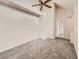 Spacious bedroom featuring neutral carpeting, a ceiling fan, and a walk-in closet at 16366 E Fremont Ave # 11, Aurora, CO 80016