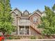 Beautiful townhome with brick and siding exterior, balcony, gated patio, and landscaped entrance at 16366 E Fremont Ave # 11, Aurora, CO 80016