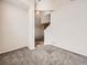 Spacious living room area with an open floor plan and neutral carpeting at 16366 E Fremont Ave # 11, Aurora, CO 80016