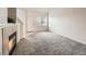 Inviting living room featuring a fireplace and entry with tile flooring at 16366 E Fremont Ave # 11, Aurora, CO 80016