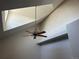 Bright living room featuring high vaulted ceilings, skylight and modern fan at 16366 E Fremont Ave # 11, Aurora, CO 80016