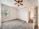Bedroom featuring a ceiling fan, and a door that leads to the bathroom at 16366 E Fremont Ave # 11, Aurora, CO 80016